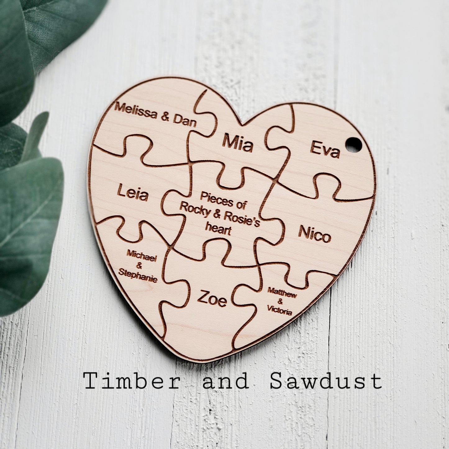 Heart-shaped puzzle ornament with your family names